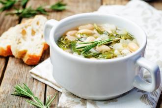 White bean soup served in a mug. 