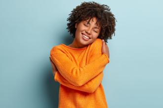 Woman hugging herself