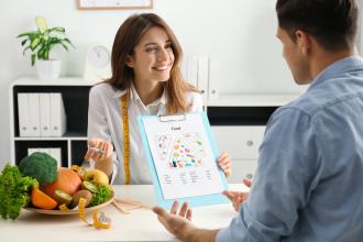 Dietitian counseling a patient.