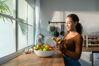 Women peeling a banana.