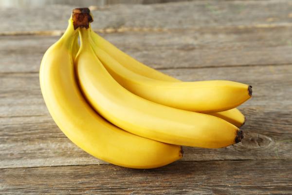 Bunch of bananas on wooden table